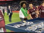 حمزة تشودري وويسلي فوفانا بعلم فلسطين بعد التتويج بكأس الاتحاد