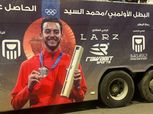 وصول محمد السيد «بطل السلاح» إلى مطار القاهرة للاحتفال مع سارة سمير والجندي